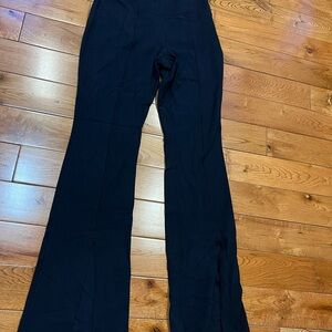 TNA - size M - yoga Flare Pants with a stylish slit on the bottom front